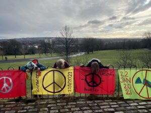 Image of peace banners at the top of the Queen's Park Flag pole to celebrate the Treaty on the Prohibition of Nuclear Weapons coming into force on January 22nd 2021